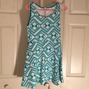 Dress knee length fits like a medium. Tag out